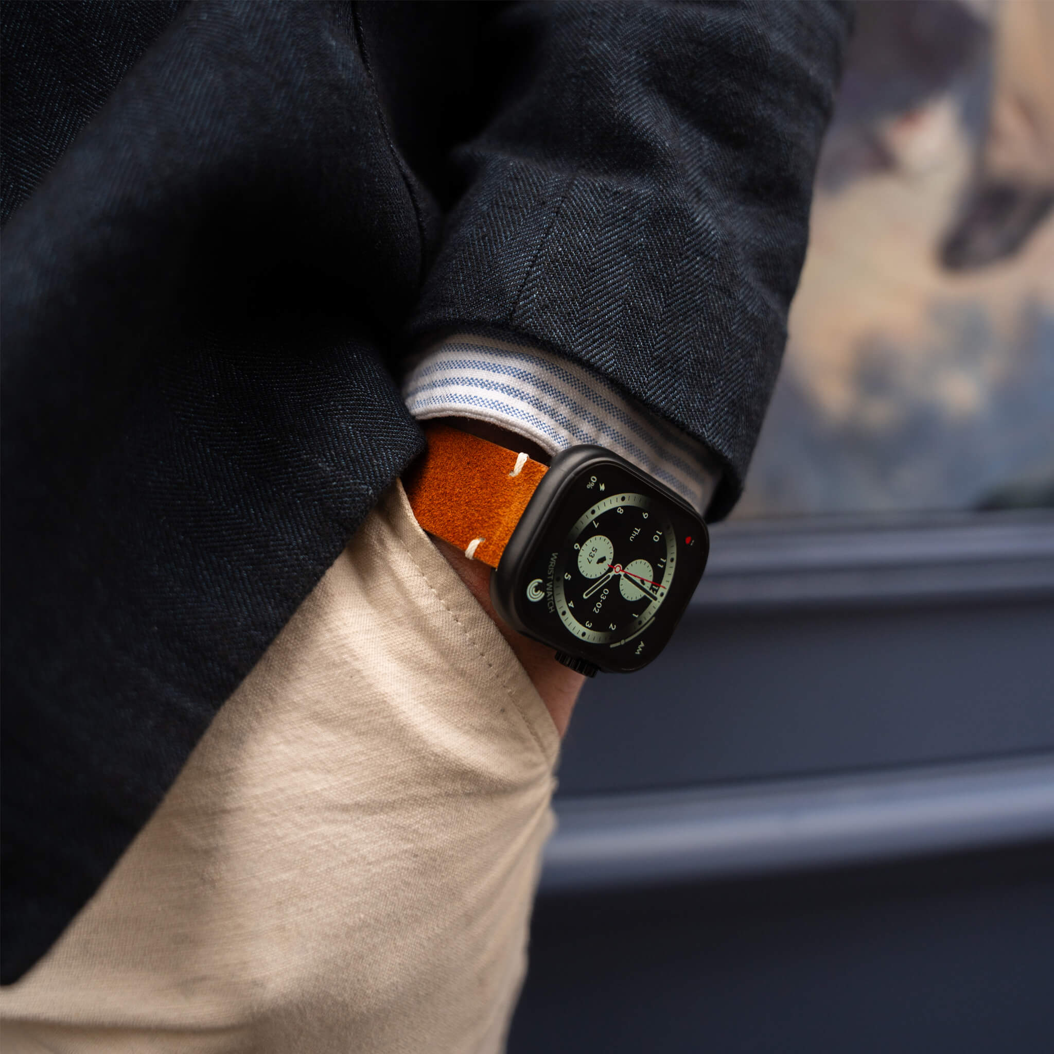 Closeup of antoine model wearing lynx smartwatch with brown suede strap.