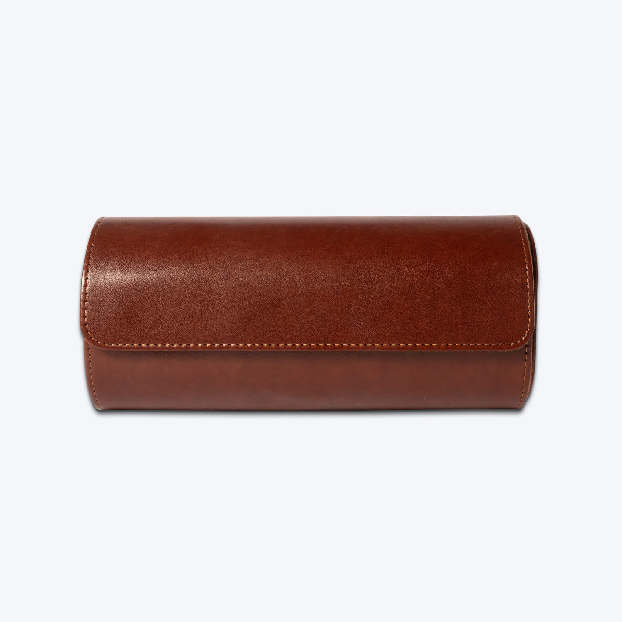 Front view of closed brown leather watch roll.